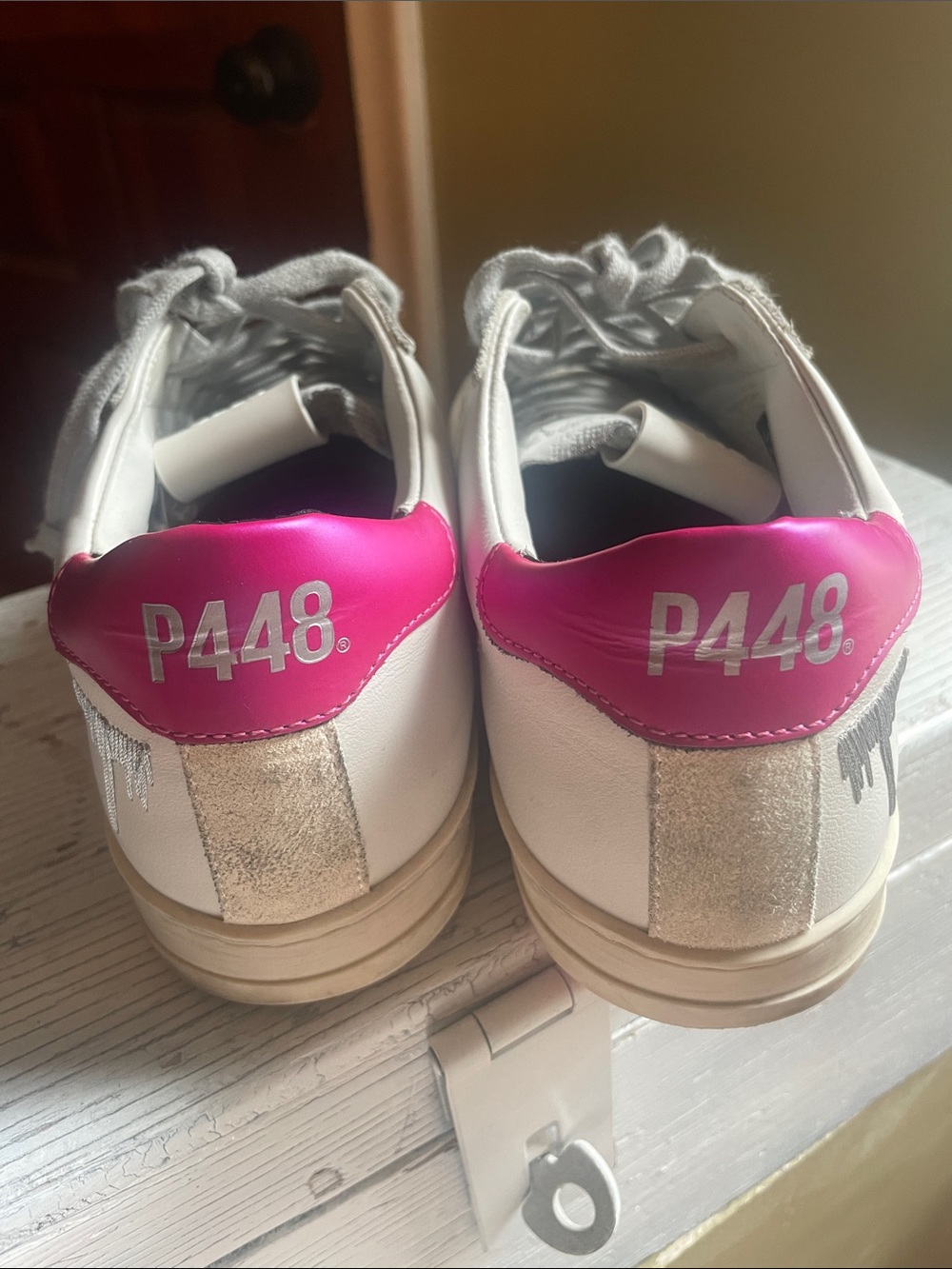 P448 White Leather Sneakers with Pink Heel Patch and Metallic Accents